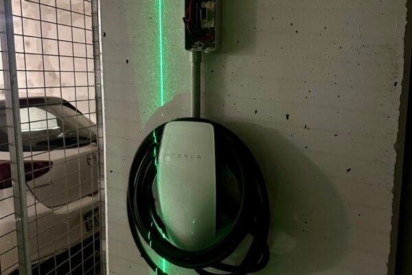 Wall-mounted EV charger installed in a carport – Marmont Electrical