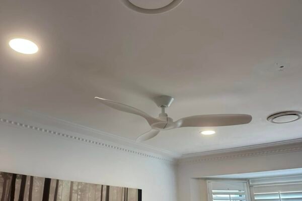 Recessed downlight and ceiling fan installed in a living room – Marmont Electrical